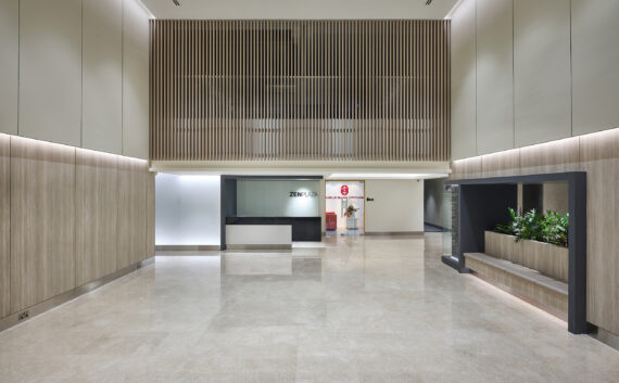 A modern and welcoming lobby at Zen Plaza with a well-organized reception area.